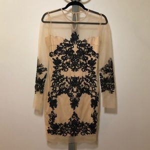 Black and nude embroidered dress.